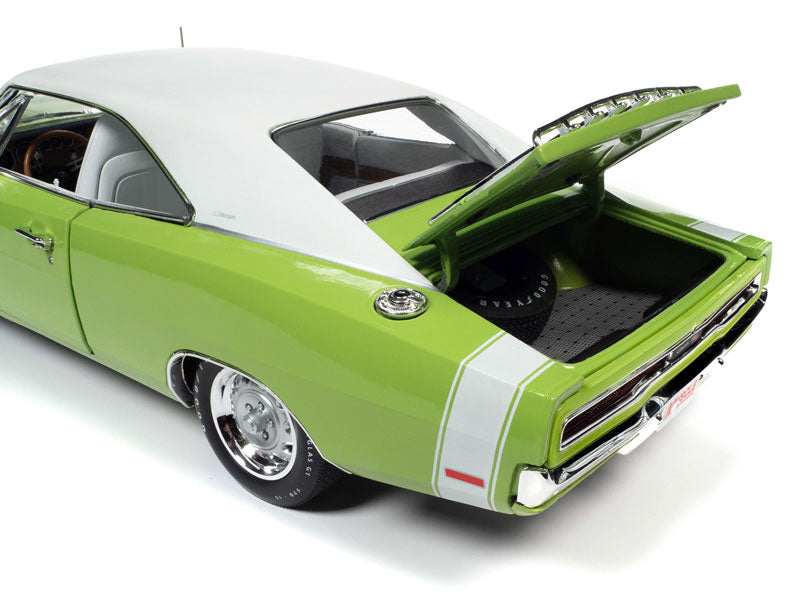 A 1/18 scale model of a 1970 Dodge Charger R/T in Sublime Green with white top and white interior, featuring a luggage rack.