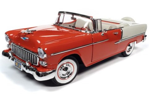 A 1/18 scale model of a 1955 Chevy Bel Air Convertible in red and ivory colors with open convertible top.