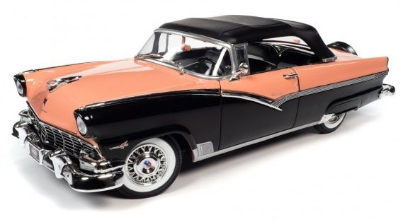A 1/18 scale diecast model of a 1956 Ford Fairlane Sunliner in coral and black color.