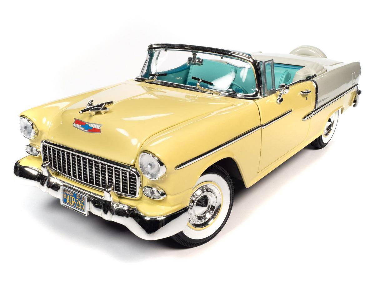 1/18 scale model of a 1955 Chevrolet Bel Air Convertible in yellow and white with the convertible top open.