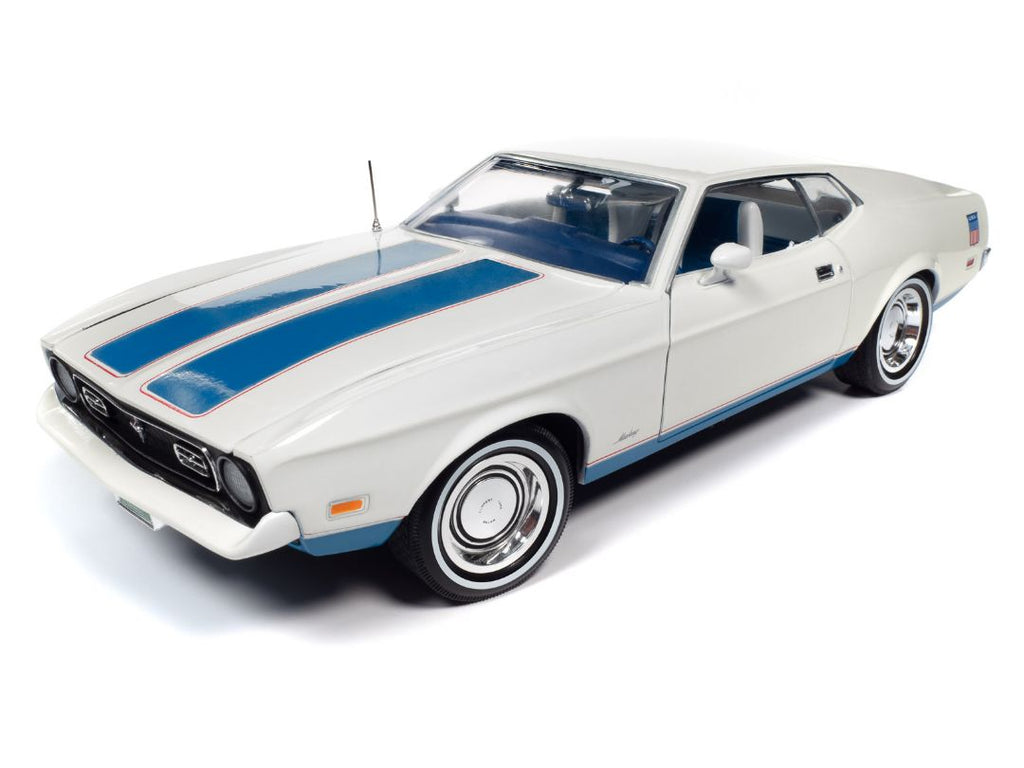 A 1/18 scale model of a 1972 Ford Mustang Fastback in white with blue stripes.