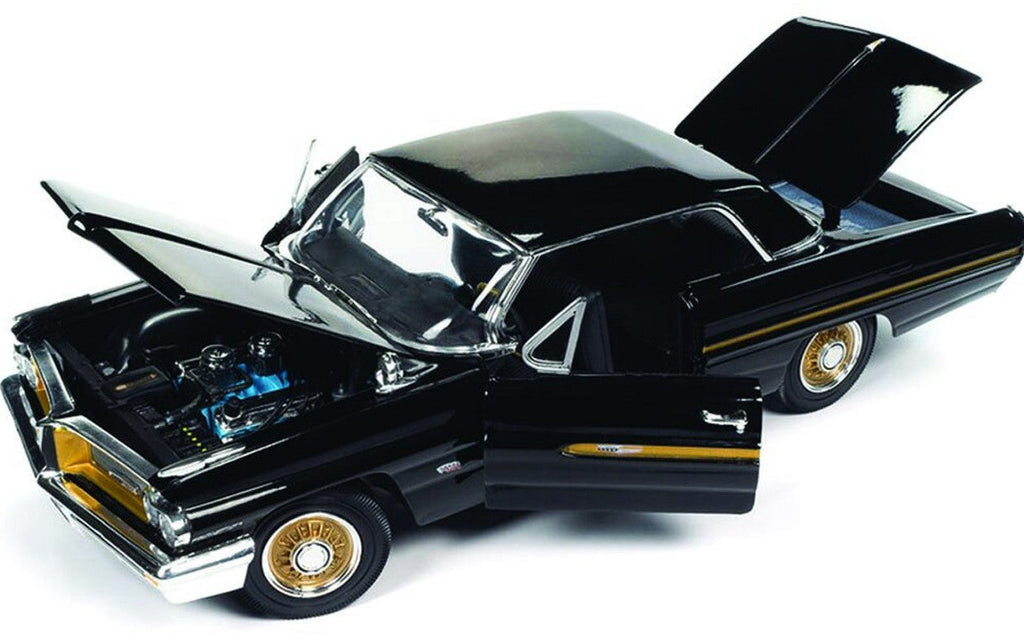 Diecast model car of a black 1962 Pontiac Grand Prix with gold accents showing opening hood, doors, and trunk.