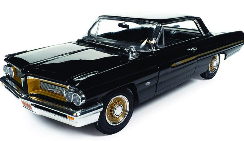 Diecast model car of a black 1962 Pontiac Grand Prix with gold accents.