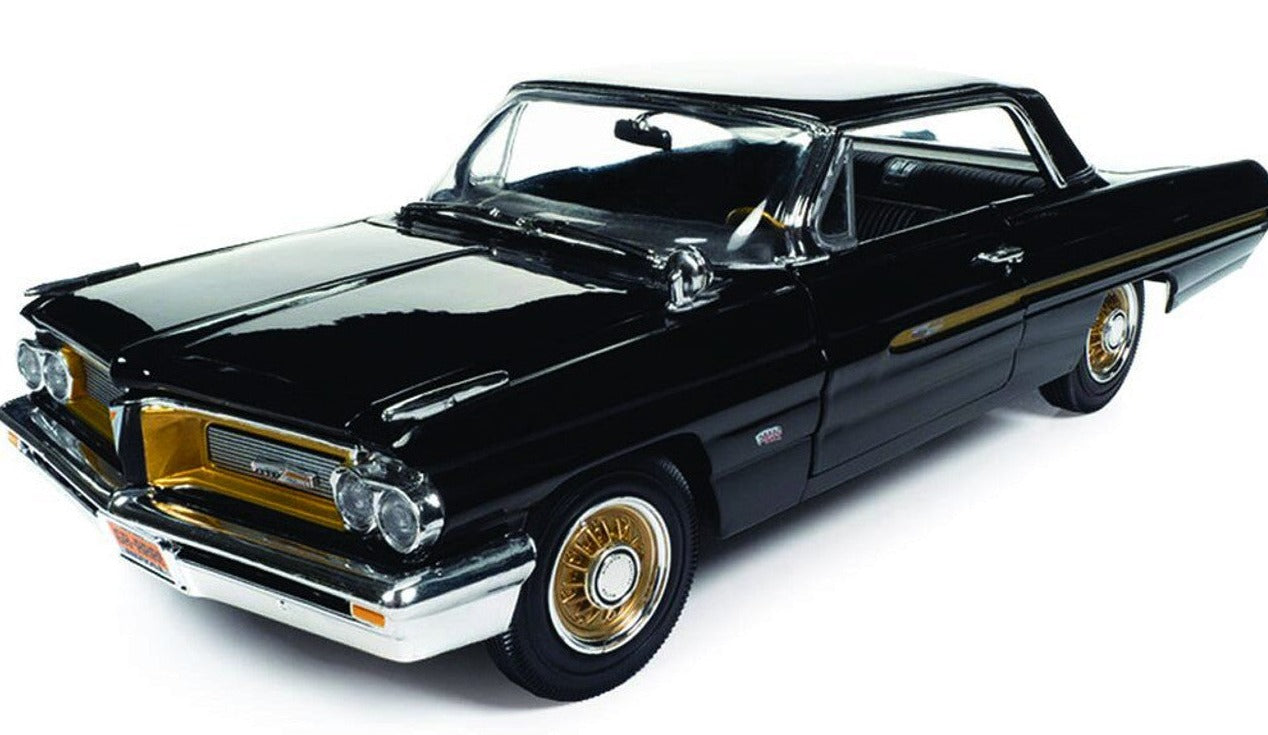Diecast model car of a black 1962 Pontiac Grand Prix with gold accents.