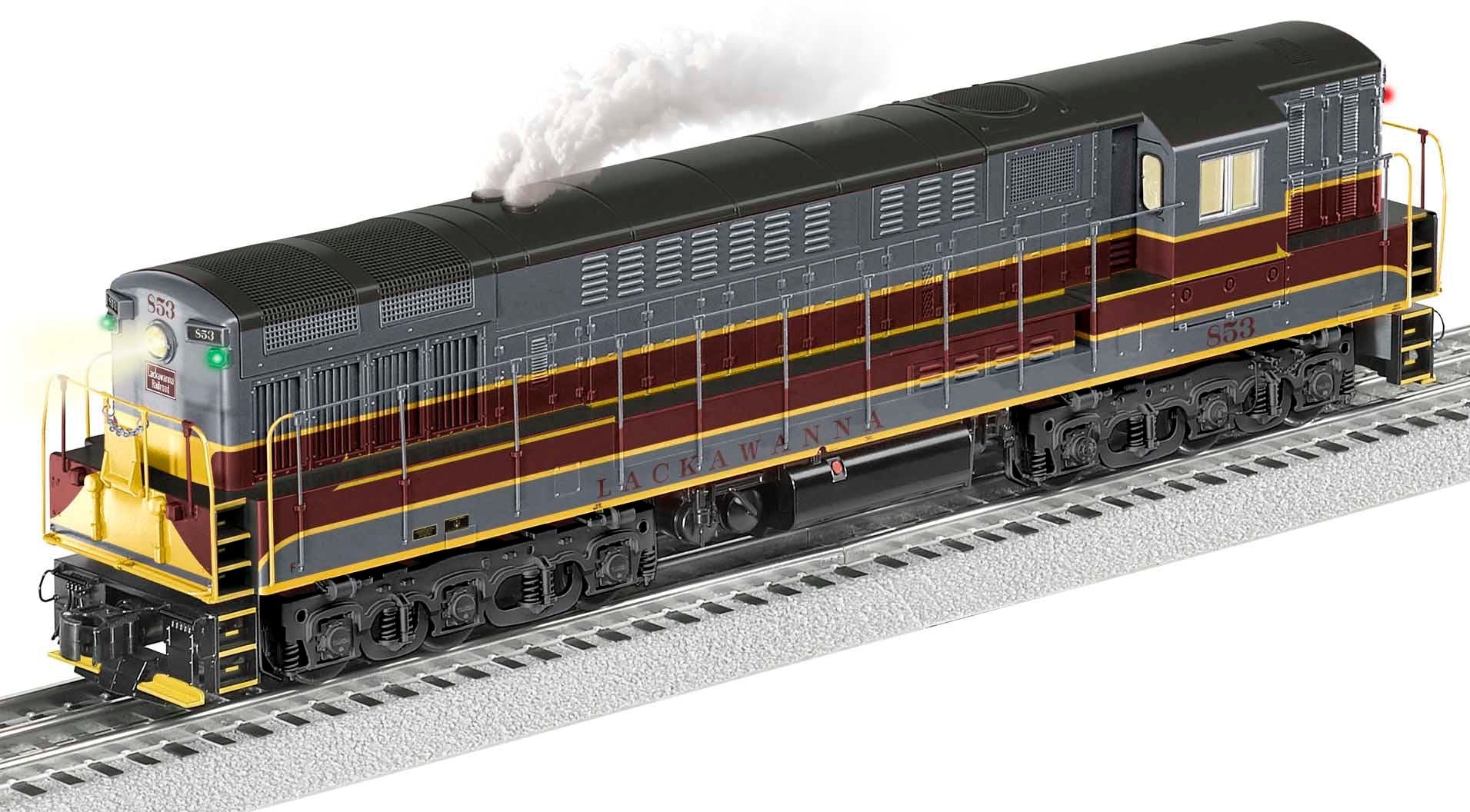 O Scale Model of TrainMaster engine with gray, maroon, and yellow paint scheme.