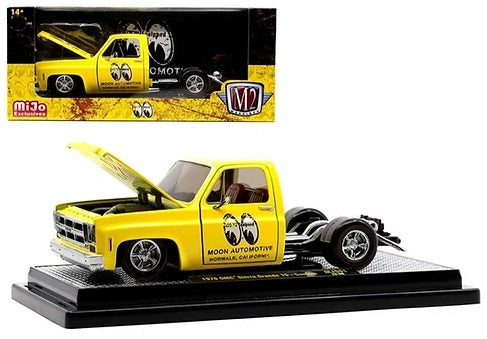 1/24 scale model of a yellow truck on a display base and a yellow truck in a package with clear display window.