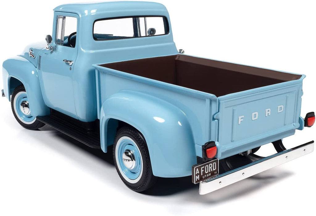 Diecast model car of a light blue 1956 Ford F-100.