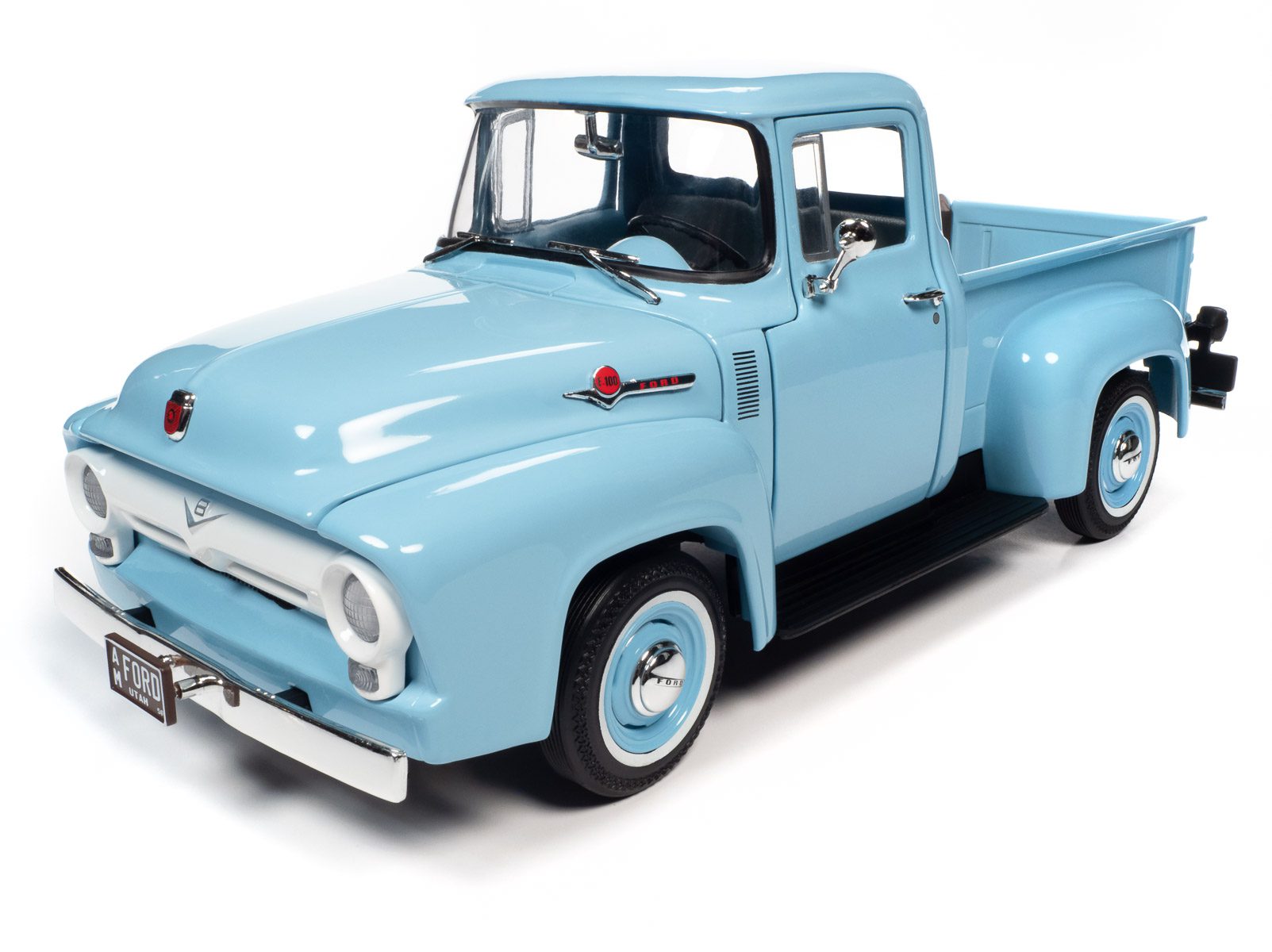 Diecast model car of a light blue 1956 Ford F-100.