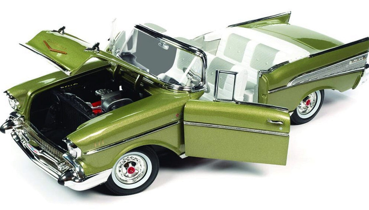 A 1/18 scale model of a 1957 Chevrolet Bel Air Convertible in green color with open convertible roof, hood, and doors.