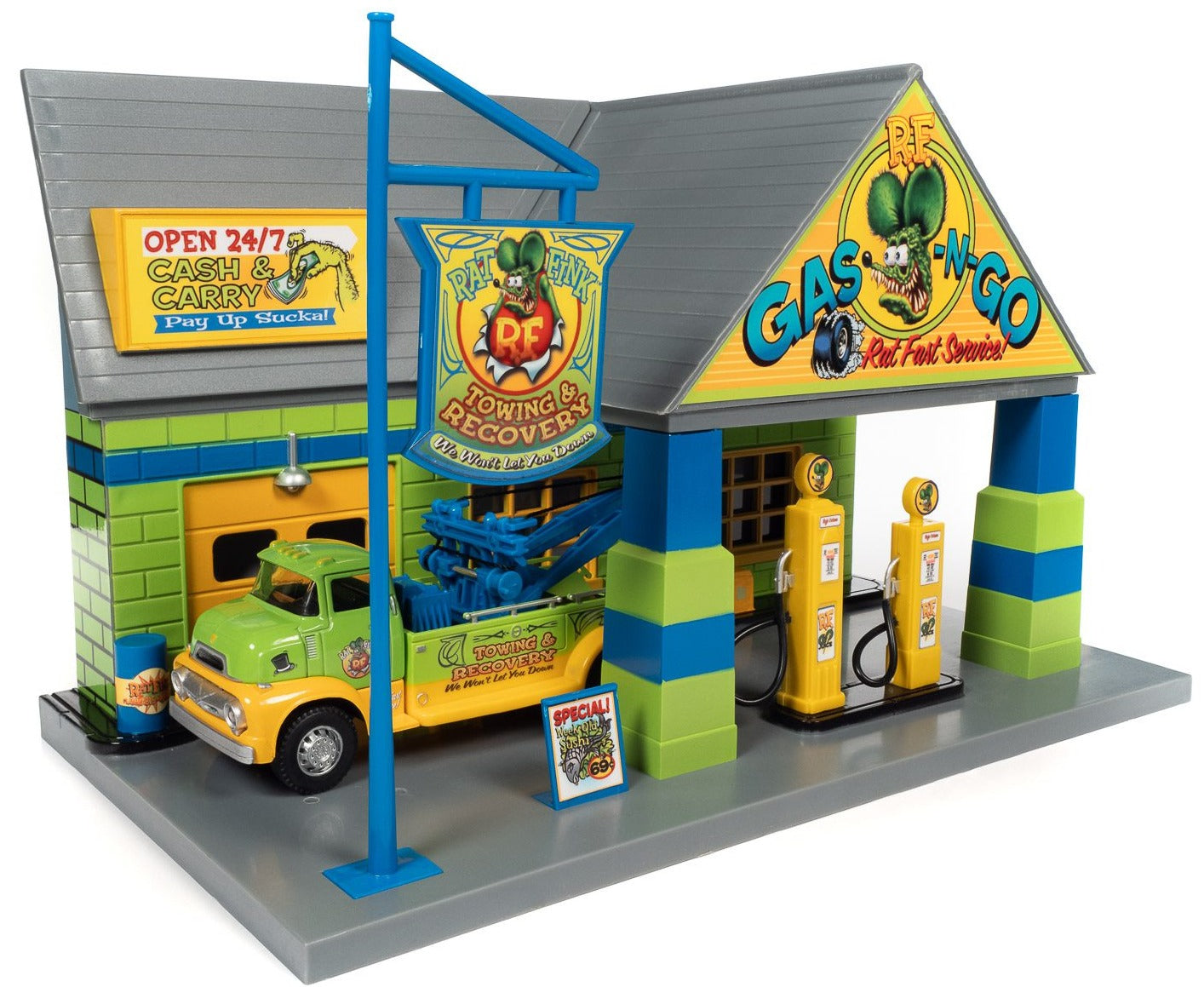 A 1/48 scale model of the Rat Fink Garage with a tow truck set. The garage and tow truck are painted in matching bright colors with Rat Fink graphics.