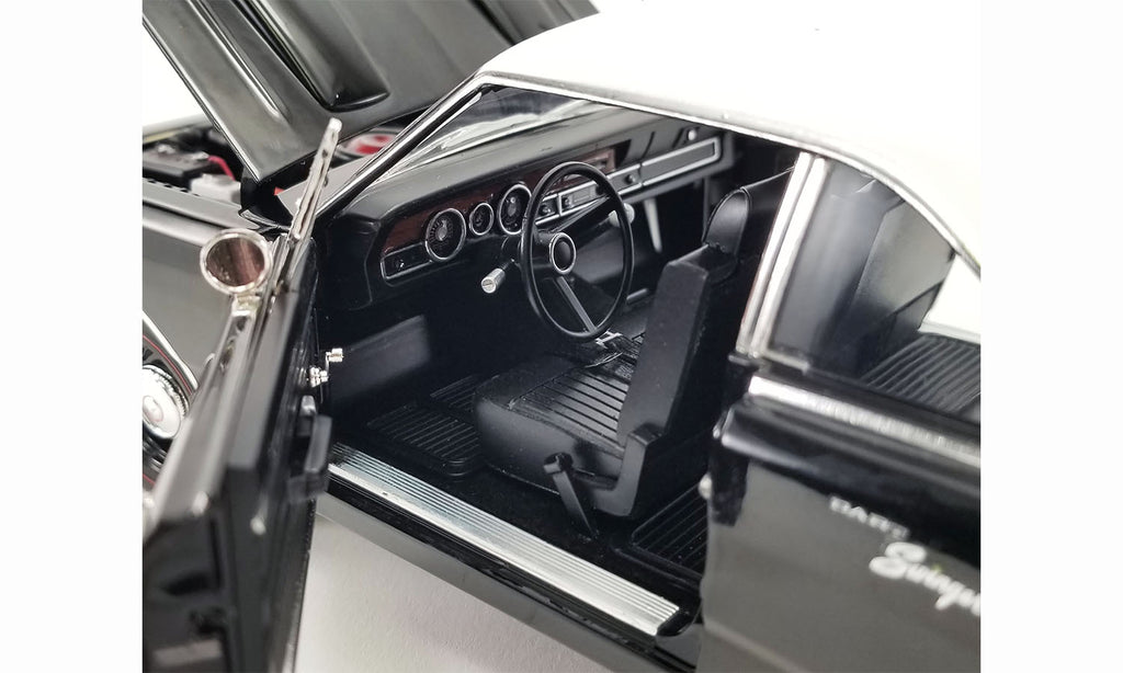 Drivers side detailed interior view of 1/18 scale diecast car of a 1970 Dodge Dart Swinger 340 with a white tail stripe and white vinyl top.
