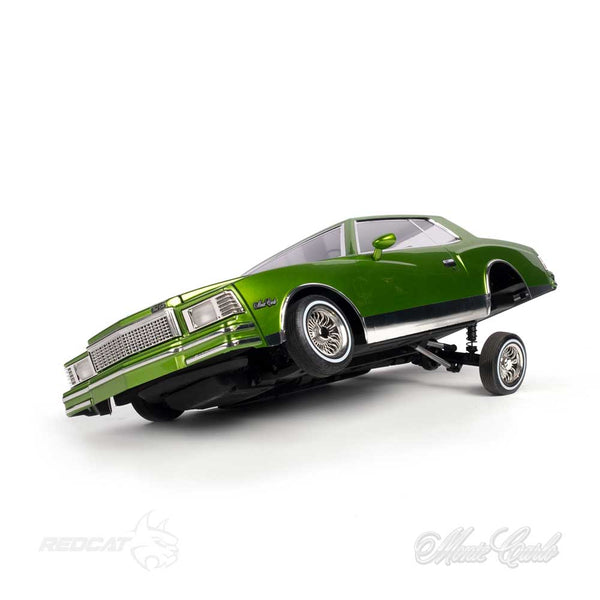 Pictured is the front/driver side view of the Remote Control 79 Monte Carlo Low Rider Ready to Run in Green with the drivers side lifted, the front tire off the ground.